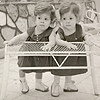 Clara and Alta Rodriguez stand side-by-side, holding onto a white table on the patio at their home in the Dominican Republic.  Courtesy C. Everett Koop (NLM UI 100961905).