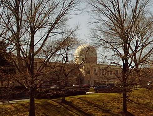 A color image of a front angled view of the  Bureau of Medicine and Surgery - a multi-story building with a large white dome over the main entrance.