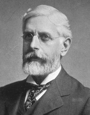 A black and white photo of Daniel Elmer Salmon in later years with white hair, full white beard, moustache and wearing round wireframe glasses.