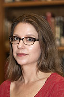 Photograph of a white woman with brown hair.