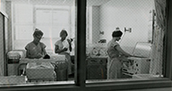 Nurses working in a nursery.