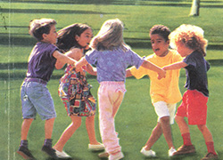 Front cover page of a booklet featuring a title and image of children holding hands and playing outside