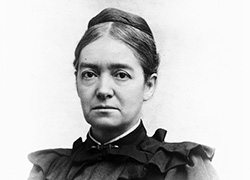 A formal black and white photographic portrait of a white woman
