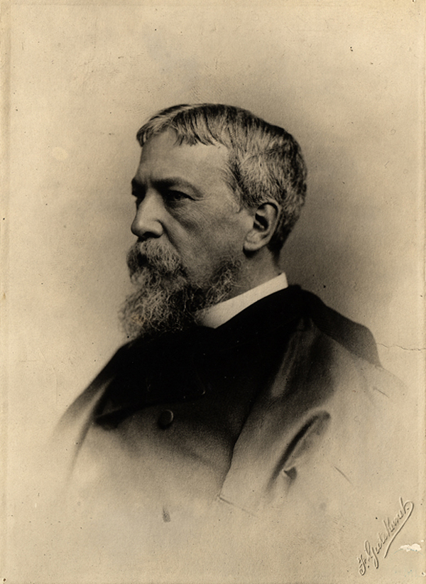A photographic portrait of S. Weir Mitchell, bearded, head and shoulders, wearing a cape.