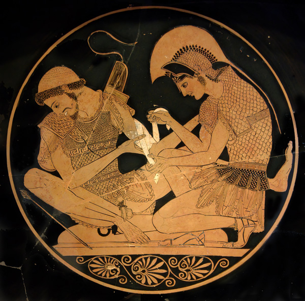 Vase painting featuring a man kneeling and treating the left arm of a seated man.