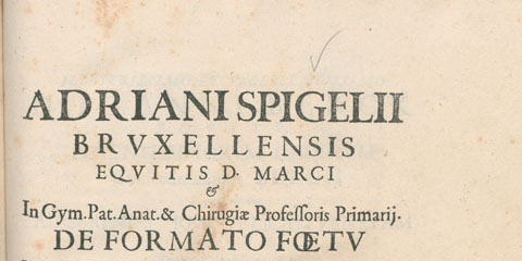Printed title page with an image of a griffin and a handwritten inscription.