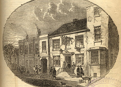 The titlepage of a pamphlet featuring a stamp from the Surgeon General’s Office Library and an engraving on the bottom of the page of the Talbot Arms, Rugeley, the scene of Cook’s death. In the engraving are old buildings with people coming in and out of them and walking on the streets.