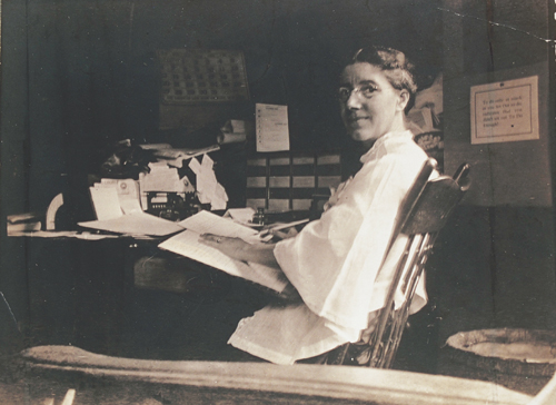 Charlotte Perkins Gilman writing at her desk
