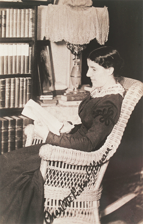 Charlotte reading in her library