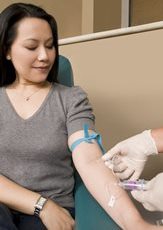 A photo of a woman having her blood drawn