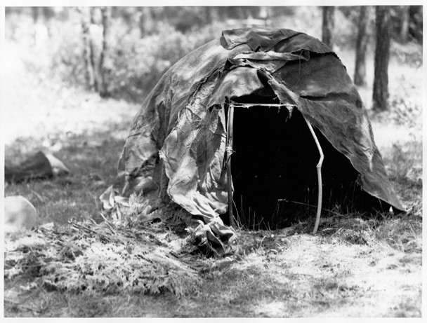 Black and white image of a single, dome-shaped structure standing by itself.