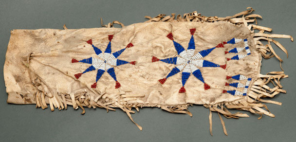 Color image of a rectangular pipe bag embroidered with two star-shaped designs.