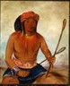 Color painting of a Native American man sitting down while holding a pair of traditional stickball sticks, one in each hand.
