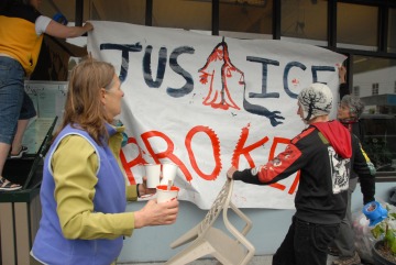 Cordovans Hang a Hand-Painted Supreme Court Exxon Valdez Court Ruling Protest Banner
