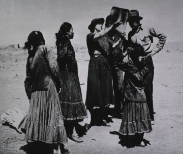 An Indian Health Service field nurse demonstrates chest x-rays to a group of Navajos