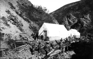 Gold miners working along a flume