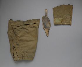 Air Force flight suit fragments and holster fragment found with Michael Blassie